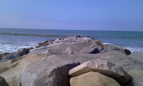 Scenic view of sea against clear blue sky