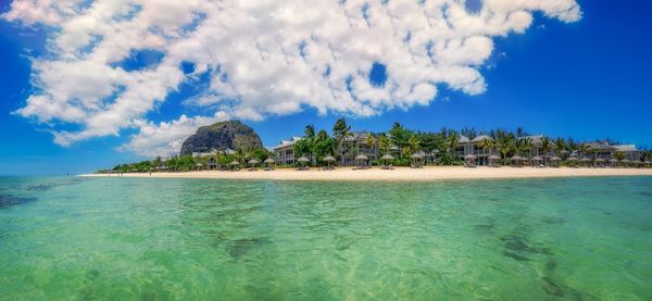 Scenic view of beach resort against clear blue sky