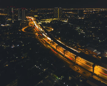 Aerial view of illuminated cityscape at night