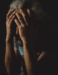 Close-up of man covering face