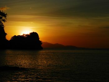 Scenic view of sea against orange sky