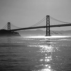 View of suspension bridge over sea