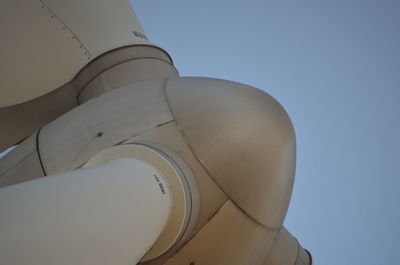 Low angle view of airplane against clear sky