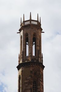 Low angle view of bell tower against sky