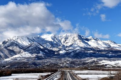 Scenic view of snowcapped mountains against sky