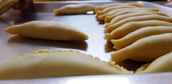 Close-up of hand preparing food