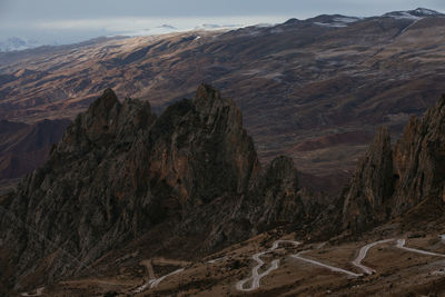 Aerial view of landscape with mountain range in background