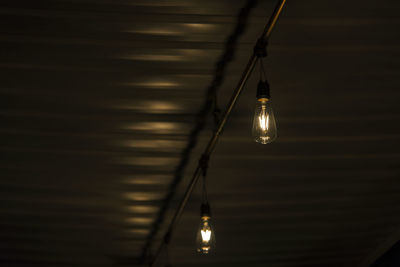 Low angle view of illuminated light bulb