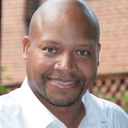 Close-up portrait of smiling mid adult man