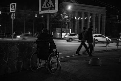 Bicycle parked on road at night