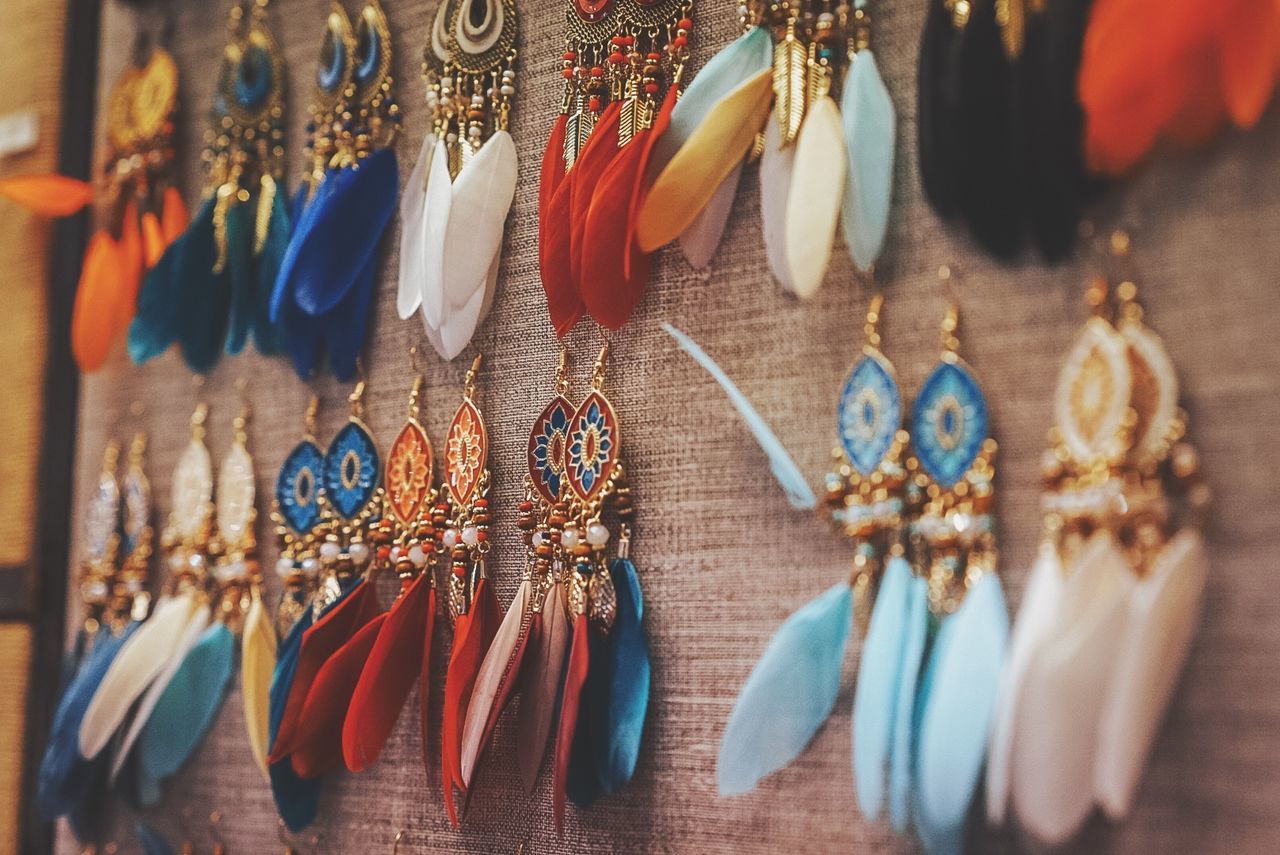 retail, market, for sale, hanging, choice, no people, large group of objects, variation, collection, art and craft, arrangement, selective focus, market stall, side by side, sale, jewelry, in a row, still life, indoors, close-up, retail display, order, personal accessory