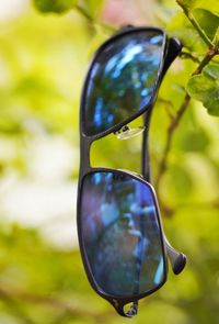 Close-up of sunglasses on glass