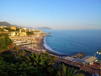 Scenic view of sea with cityscape in background