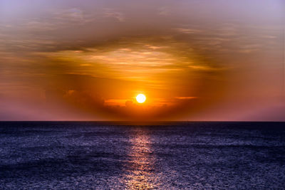 Scenic view of sea at sunset