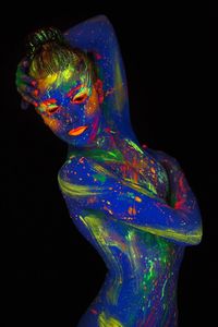 Multi colored light painting against black background