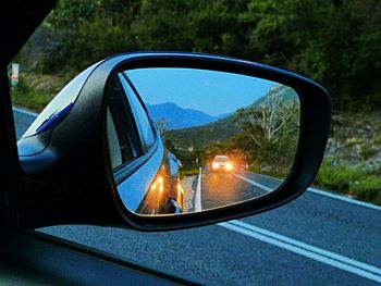 Cropped image of car on road