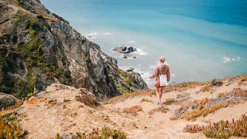 Panoramic view of people standing on beach