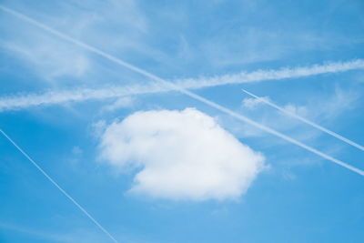 Low angle view of vapor trail in blue sky