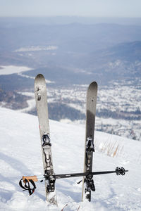People skiing on snow covered landscape