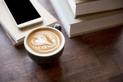 High angle view of coffee cup on table