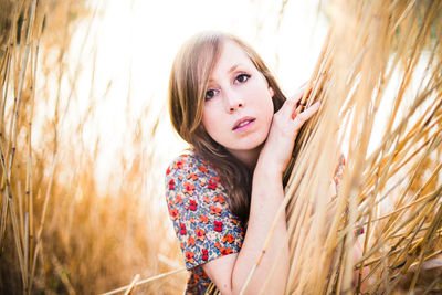 Portrait of woman by plants