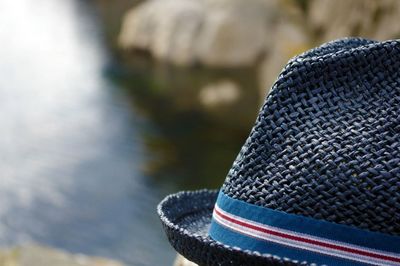 Close-up of a cropped hat against blurred background