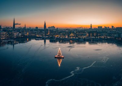 Aerial view of hamburg's inner city on a cold winter day with the illuminated christmas tree