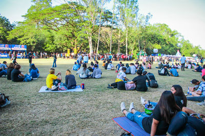 Group of people relaxing in park