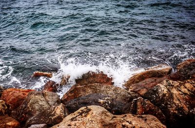 Sea waves splashing on rocks