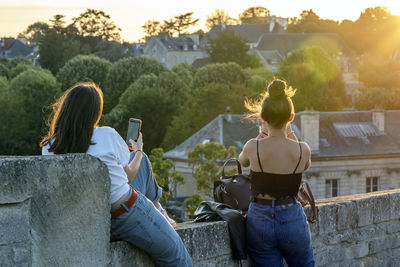 Rear view of people sitting outdoors