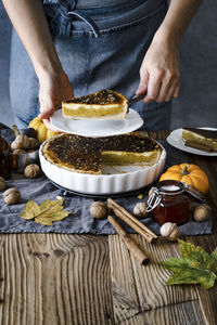 Midsection of man preparing food on table