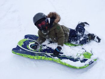 Midsection of man skiing on snow covered mountain