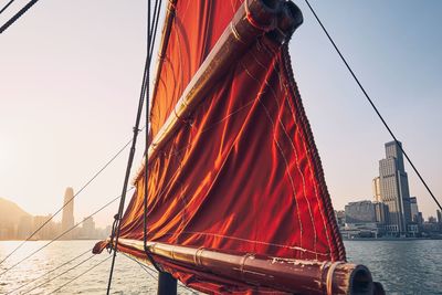 Panoramic view of sailboats in city against sky