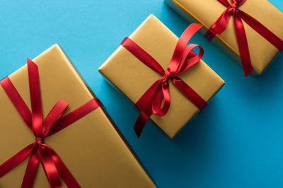 Close-up of christmas presents against blue background