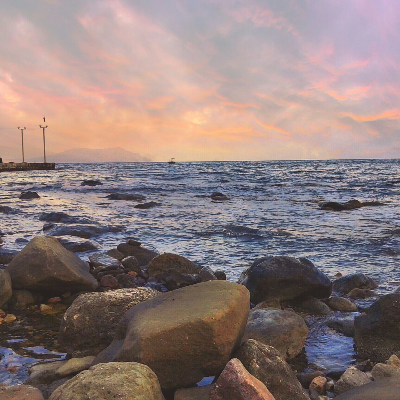 sea, water, sunset, scenics, sky, beauty in nature, tranquil scene, horizon over water, rock - object, tranquility, nature, cloud - sky, beach, shore, idyllic, orange color, rock, remote, cloud, non-urban scene