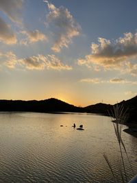 Scenic view of lake against sky during sunset