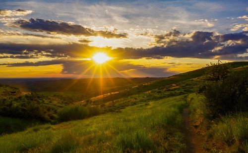 Scenic view of landscape against sky during sunset