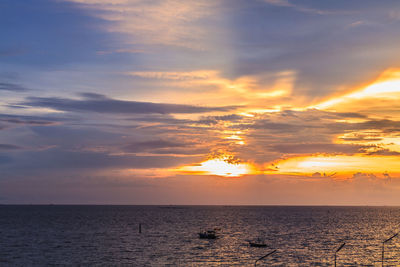 Scenic view of sea against dramatic sky