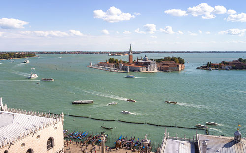 High angle view of sea and buildings against sky