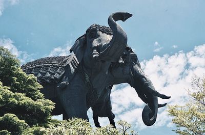 Low angle view of statue against sky