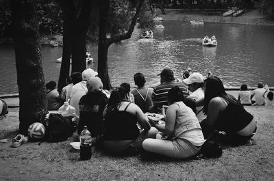 People sitting by sea