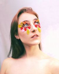 Portrait of a beautiful young woman over white background