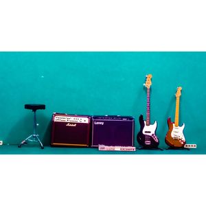 Close-up of guitar on table against wall