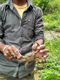 Midsection of man working in basket