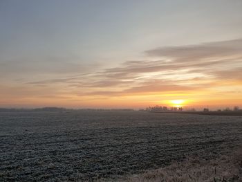 Scenic view of sunset over land