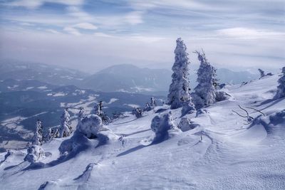 Scenic view of snow mountains against sky