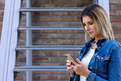 Young woman using mobile phone