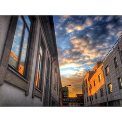 Low angle view of building against cloudy sky