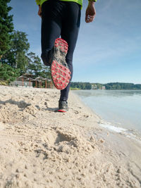 Low section of woman on beach