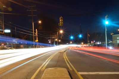 Light trails on road in city at night